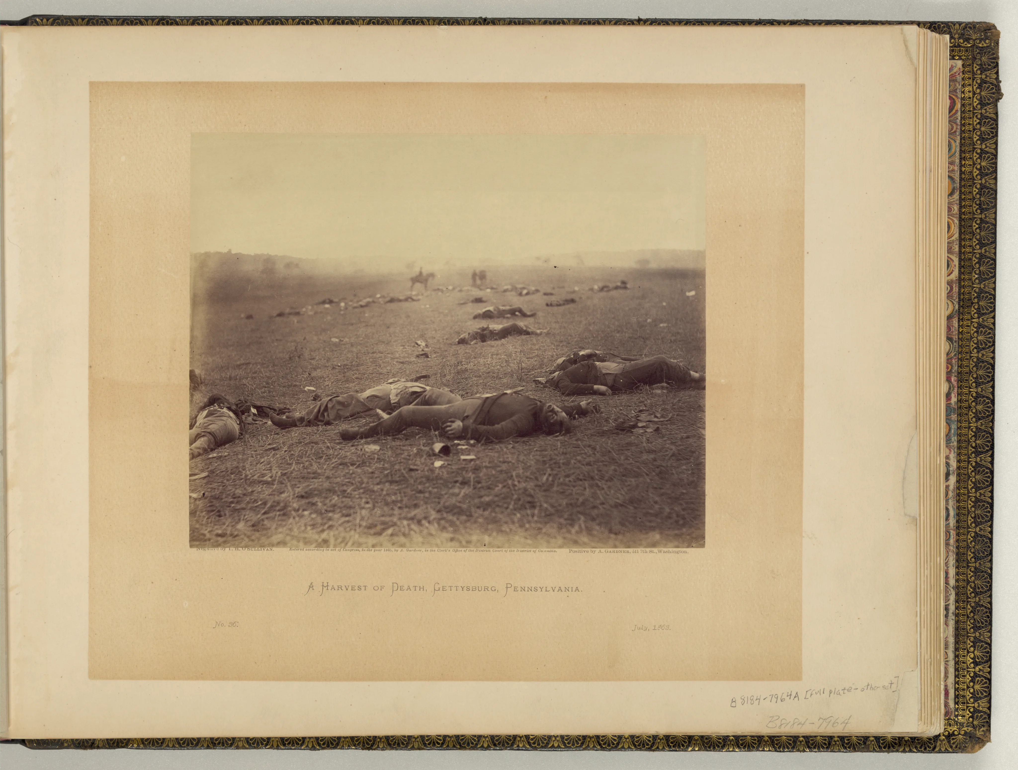 War dead on the Gettysburg battlefield, with the ground and distant figures fading from clarity.
